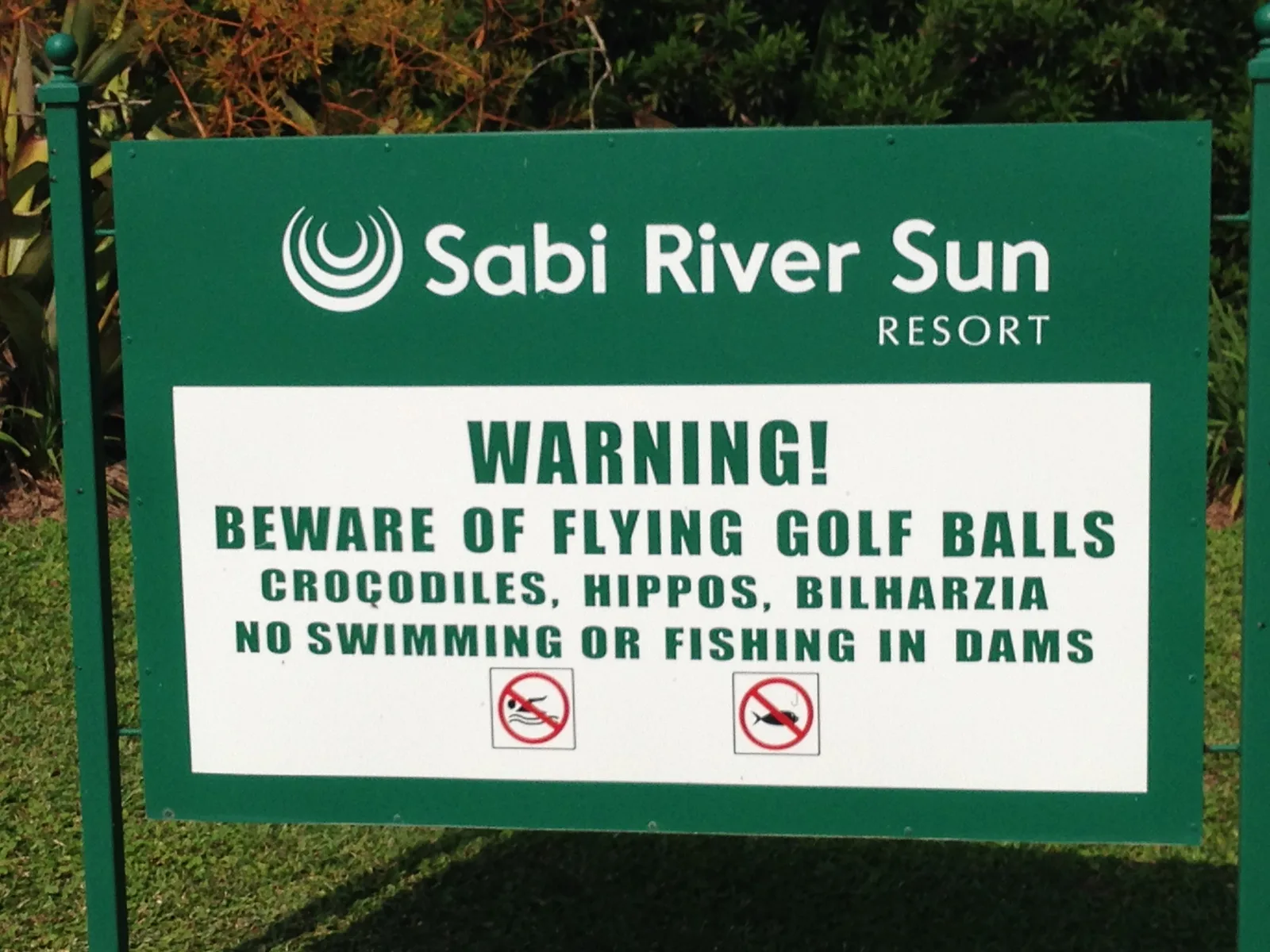 A Sabi River Sun sign warning of flying golf balls, crocodiles and hippos